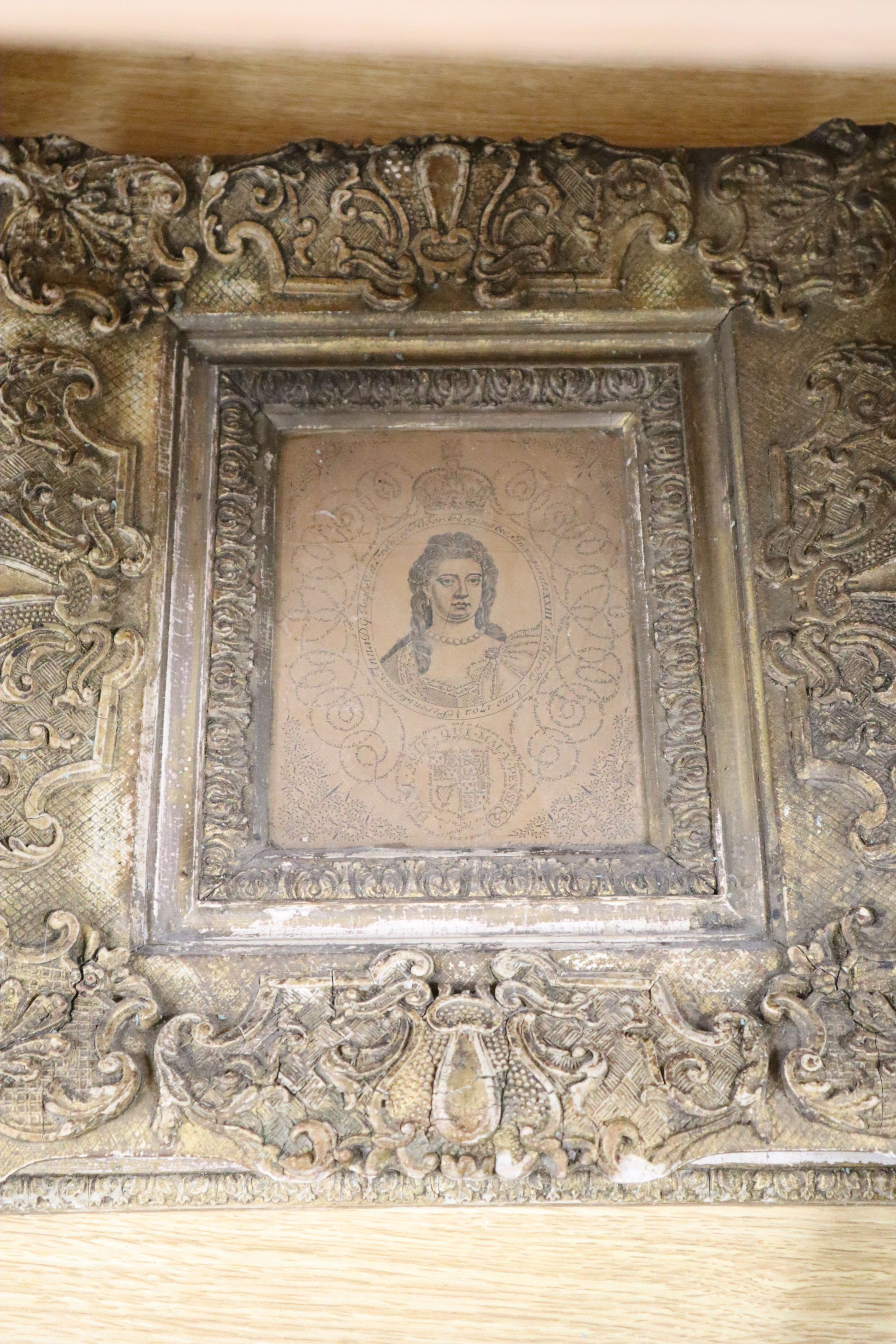 A pair of Victorian ornate gilt gesso oval picture frames, 50 x 55cm, a similar wall shelf and a picture